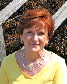 Judie Ricciardi, President and Owner of Put It Together, llc at her studio (chair fabric at Harmonyart.com)